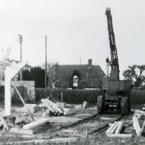 1957 crane erects uprights on the Second Village Hall743